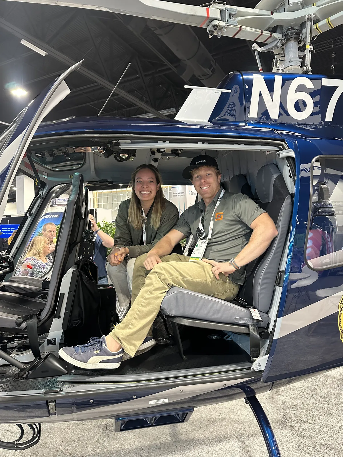 Two team members in a police helicopter on the IACP show floor